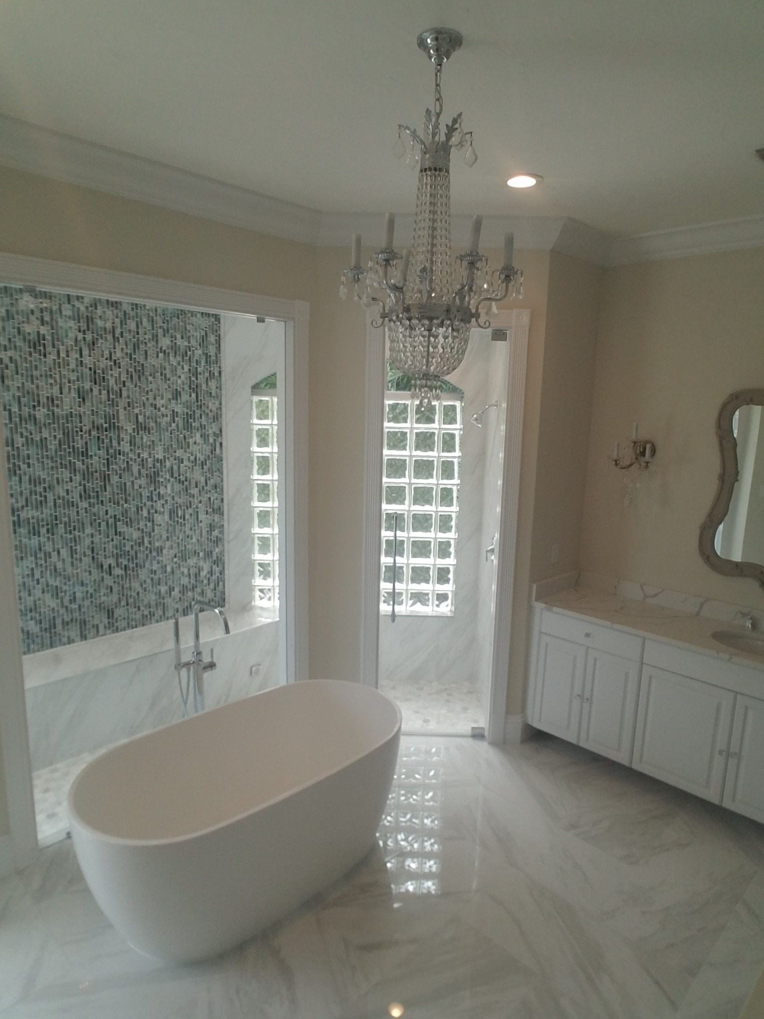 Wide view of completed primary bathroom renovation